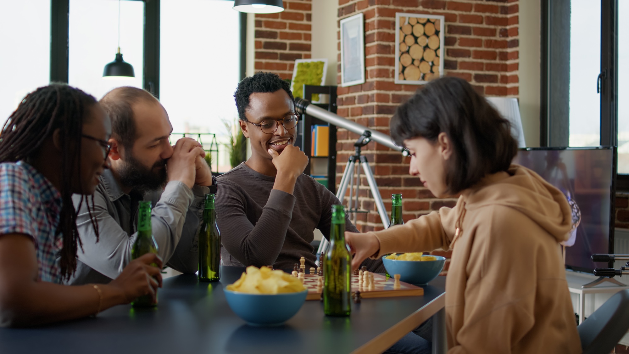 Diverse group of friends playing strategic board games